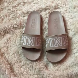 pink flip flops/ slides.